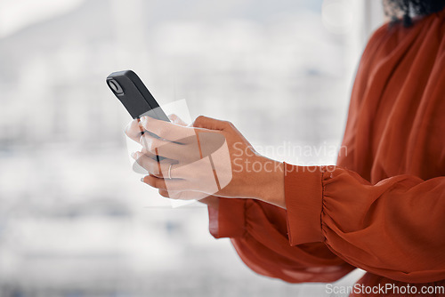 Image of Closeup hand, phone and networking of a person for business, social media or online app on bokeh. Office, digital and an employee or worker with a mobile for a contact, web news or cellphone typing