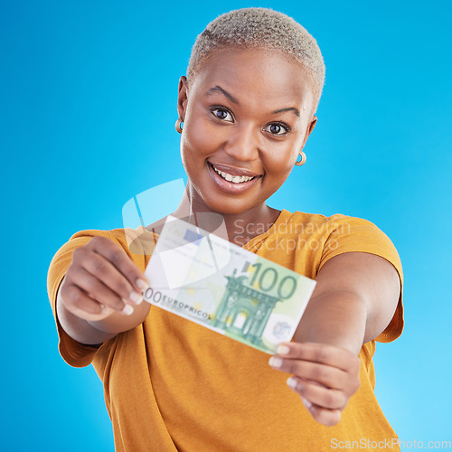 Image of Money, note and happy woman in portrait for success, cash offer and investment choice on blue background. Face, financial profit and african person or winner with bonus, cashback or payment in studio