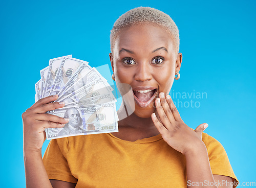 Image of Money, wow and black woman in portrait for success, student loan or lottery fan on blue background. Surprise face, bonus and young person, student or winner for cashback or financial growth in studio