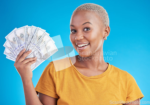 Image of Black woman, cash fan and finance, portrait and happy with prize, loan and dollars isolated on blue background. Money, cashback and lottery win with payment, financial freedom and bills in studio