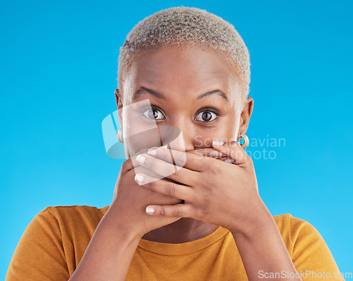 Image of Gossip, secret or portrait black woman shocked by mistake or announcement in studio on blue background. Wow, fake news or surprised girl with excited, wtf or omg expression with hands to cover mouth