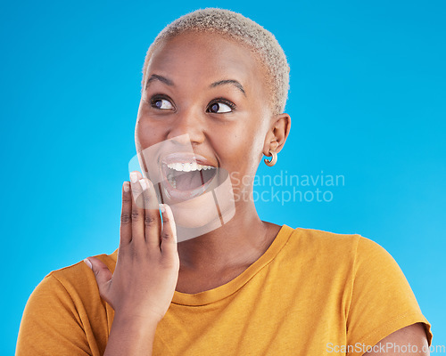 Image of Surprise, thinking or excited black woman in studio for shocking news or deal offer on blue background. Wow reaction, omg and happy female person shocked by gossip, announcement, promotion or deal