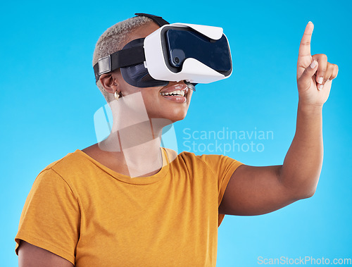 Image of Black woman, metaverse and virtual reality, touch screen with future technology and 3D on blue background. User experience, VR goggles and female person, digital world and gaming software in studio