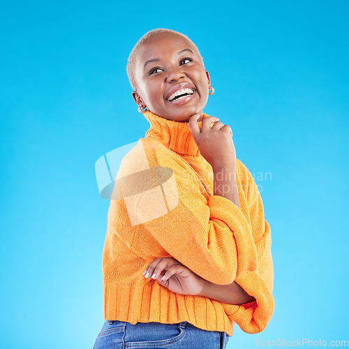 Image of Happy, African woman and thinking of fashion in studio, blue background or natural beauty and confidence in casual style or clothes. College student, arms crossed and happiness in winter clothing