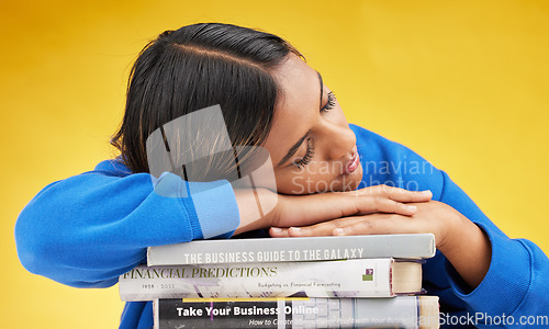 Image of Woman, student and sleeping with books in studio with burnout, financial education and tired by yellow background. Gen z girl, learning and studying business with fatigue, knowledge and development