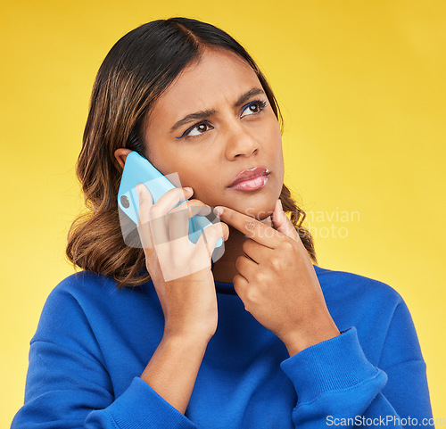 Image of Phone call, thinking and woman confused, doubt and communication on a yellow studio background. Person, network and model with a smartphone, connection and spam problem with scam and conversation