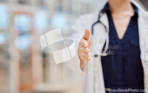 Image of Handshake, offer and doctor introduction, thank you and healthcare deal, success or welcome to consultation. Medical professional or person shaking hands in patient POV for clinic support in closeup