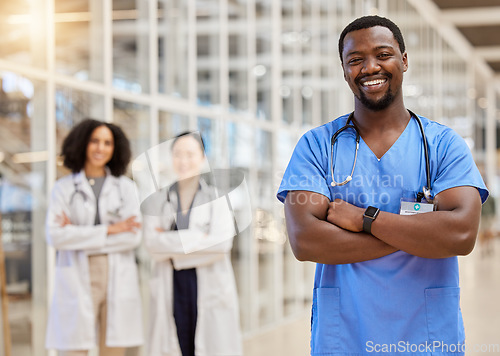 Image of Happy black man, portrait and doctor with arms crossed for medical services, advice and consulting in busy hospital. Surgeon, male nurse and healthcare therapist for expert, trust and pride in clinic