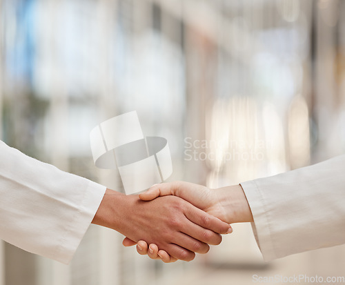 Image of Doctors, partnership and handshake for teamwork, collaboration and agreement. Shaking hands, medical professional and people in cooperation for healthcare, wellness and thank you, welcome and success