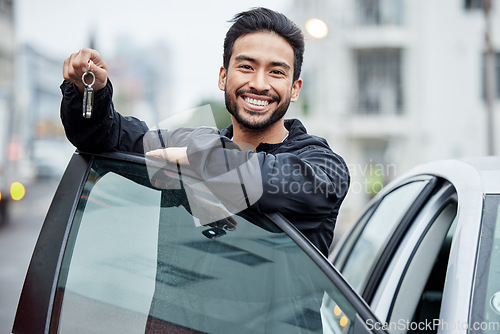 Image of New car, city and portrait of man with keys after vehicle purchase to drive, transport and travel on street. Transportation, loan approval and happy person with freedom for trip, journey or adventure