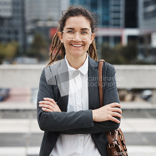 Image of Business, crossed arms and portrait of woman in city on morning commute, journey and travel. Professional, corporate worker and happy female person for career progress, work and future in urban town