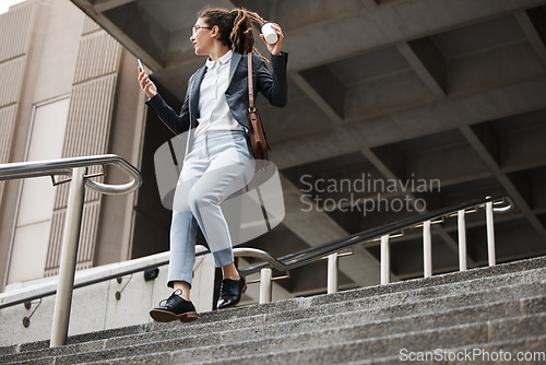 Image of Stairs, city and business woman walk, travel or using phone, schedule or check time on outdoor journey. Cellphone, work coffee break and professional person leave office building on staircase steps