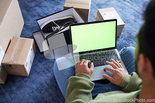 Image of Green screen, man with laptop, online shopping and box on floor, shoes and delivery service on digital app. Sale, discount and ecommerce on fashion retail brand website, internet search on computer.