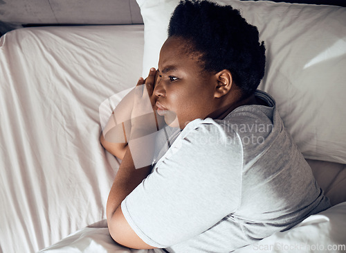 Image of Stress, thinking or black woman in bed with insomnia or anxiety from sleeping problem in bedroom. Wake up, burnout or tired African girl with mistake, loss or depression from emotional grief at home