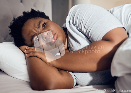 Image of Black woman, depression and insomnia, thinking with mental health problem, tired and stress with anxiety at home. Female person in bed, depressed and psychology with life crisis and sad with grief