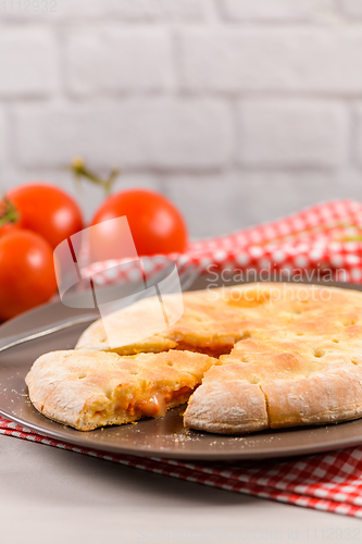 Image of Pizza calzone on wooden background