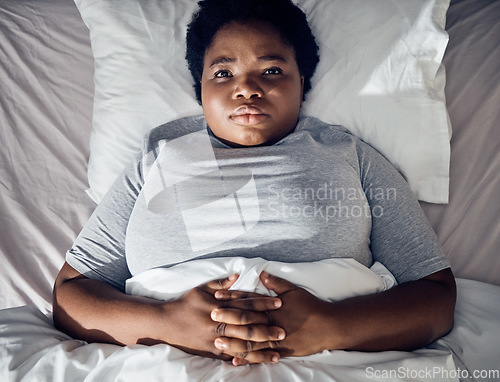 Image of Stress, bed or top of woman thinking of depression, insomnia or mental health problem in house bedroom. Worry, lonely or tired person with broken heart, loss or anxiety from emotional grief at home