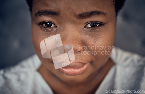 Image of Sad, crying and black woman with depression, anxiety and financial crisis. Tears, stress and African person in pain from breakup, trauma and disaster of death, mental health problem and frustrated