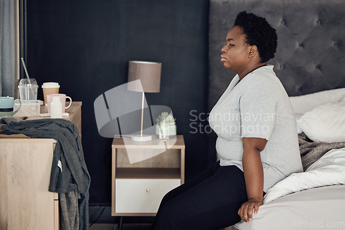 Image of Thinking, bed and black woman with depression, stress or anxiety from broken heart or divorce at home. Sad, insomnia or person worried by breakup, trauma or disaster of death or mental health mistake