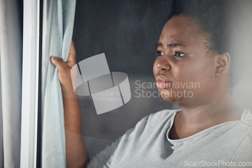 Image of Curtain, thinking or black woman with depression, stress or mental health problem by window at home. Worry, lonely or tired African person with broken heart, loss or anxiety from emotional grief