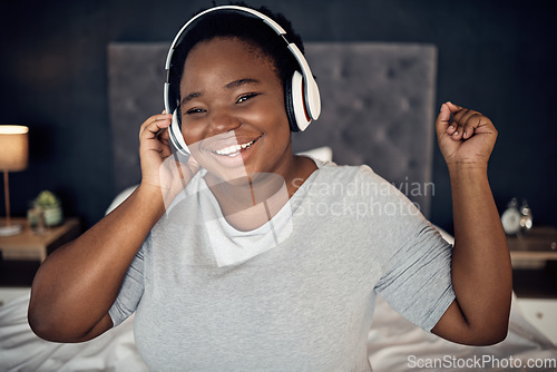 Image of Smile, music headphones and black woman in portrait, dance and happy in home bedroom. Radio, listening and face of plus size African person hearing audio, podcast and streaming sound online at night