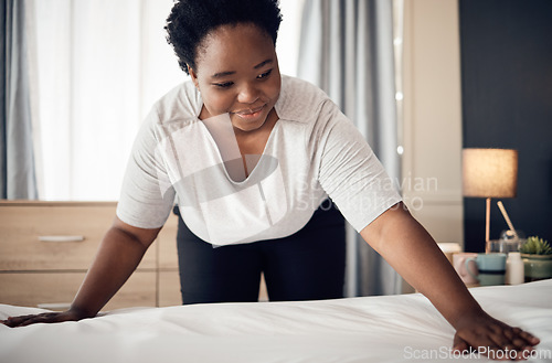 Image of Black woman, bed and cleaning bedroom, hygiene and housekeeping with morning routine at home. African female person, cleaner service and change sheets with maintenance, housekeeper and hospitality