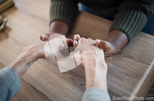 Image of Holding hands, support and praying, people and counseling top view with psychology and therapy together. Kindness, respect and worship, trust and help, wellness with communication, comfort and care