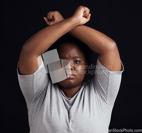 Image of Portrait, human rights and a black woman in protest of domestic violence on a dark background. Freedom, equality or empowerment with a serious young female person in studio for gender discrimination