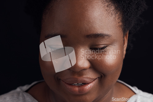 Image of Crying, sad and a black woman on a studio background with depression, fear or mental health. Studio, face and an African girl or person with tears, frustrated or fail from a mistake on a backdrop