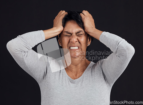 Image of Anger, anxiety and senior woman screaming, depression and mental health issue on a dark studio background. Person, emotion or model shouting, frustrated and angry with bipolar, moody and lose control