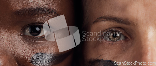 Image of Eyes, diversity and empowerment with women closeup in studio for human rights or gender equality. Portrait, face and courage with confident female people in a politics protest of violence together