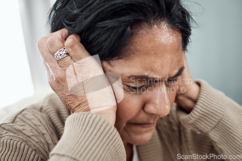 Image of Schizophrenia, bipolar or mature woman with depression, anxiety or mental health problem at home. Worry, fear or sad senior person thinking of broken heart, death loss or stress from emotional grief