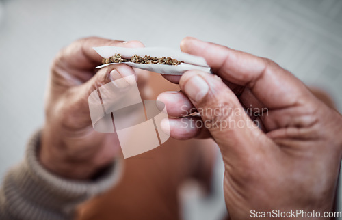 Image of Marijuana, cannabis or hands rolling weed joint for calm peace to relax or help reduce stress or anxiety. Smoker, smoking cbd or closeup of person with hemp blunt for mental health benefits on 420