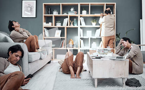 Image of Mental health, depression or anxiety with a busy woman in the living room of her home during a financial crisis. Stress, headache and burnout with a senior female person multitasking in her house