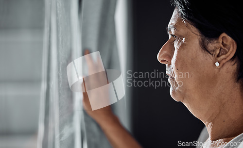 Image of Serious, senior woman and thinking about future, window in nursing home or decision for retirement, life insurance and healthcare. Elderly person, anxiety and depression in mental health about death