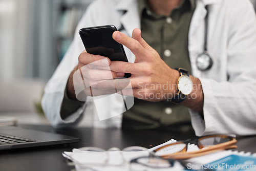 Image of Hands, phone and doctor in office with social media, texting and web scroll. Person, mobile message and employee in clinic with online networking and telehealth consultation on company website