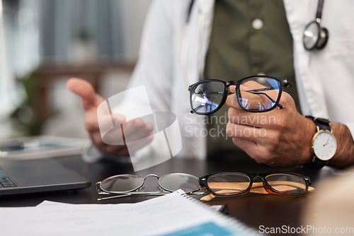 Image of Glasses, choice and doctor hand in optometrist office with lens shopping and wellness option. Frame, vision and optician decision in clinic for eye support, health and medical exam with professional