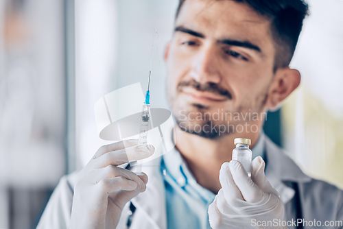 Image of Man, doctor and syringe with vial for cure, healthcare or medication for injection at the hospital. Male person or medical professional holding needle for dose, diagnosis or drugs at the clinic