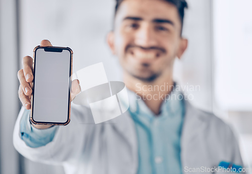 Image of Happy man, doctor and phone mockup screen for healthcare advertising or marketing at the hospital. Male person or medical professional show mobile smartphone display for Telehealth or app at clinic