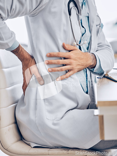 Image of Man, doctor and hands with back pain from injury, accident or posture sitting on chair at the hospital. Closeup of male person, medical or healthcare employee with sore spine, ache or cramp at clinic