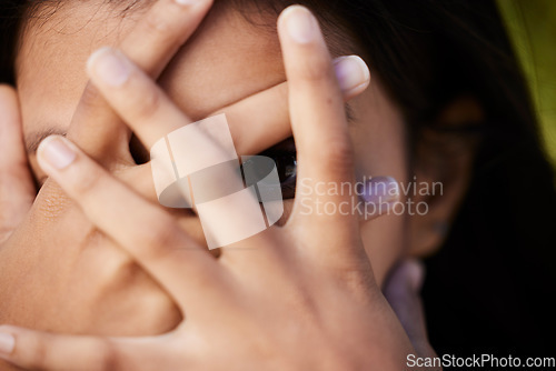 Image of Woman, eye and face cover closeup with hiding and secret in nature with female person. Model, hands and covering portrait with wellness, anonymous and people outdoor feeling scared and shy from fear