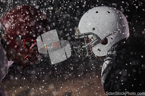 Image of Two american football players face to face in silhouette shadow on white background