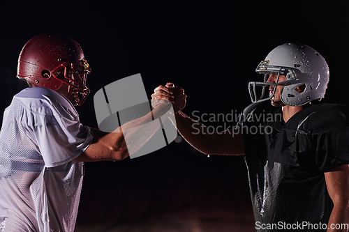 Image of Two american football players face to face in silhouette shadow on white background