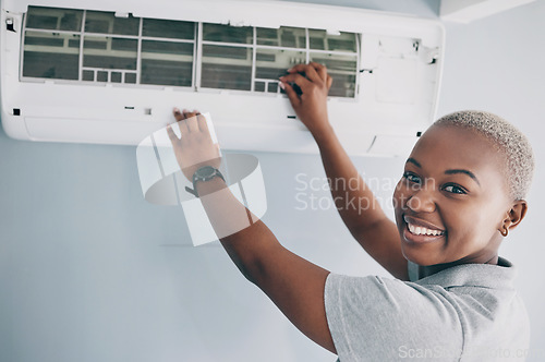 Image of Portrait, black woman and electrician for ac repair, electrical box and fan maintenance. Happy female mechanic, technician and engineer fix power system, hvac service and air conditioning machine