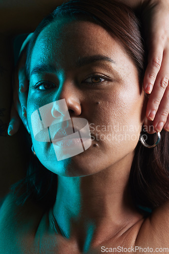 Image of Neon light, beauty and shadow portrait of Asian woman with natural cosmetics, blue facial lighting or skincare glow. Creative luxury makeup, dark studio or face of Japanese person on black background