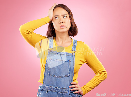 Image of Confused, thinking and asian woman in studio with questions, problem or choice on pink background. Doubt, decision and and Japanese female with why, emoji or frustrated by news, promo or wondering