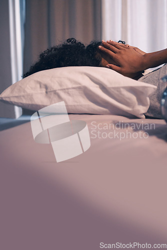 Image of Tired, burnout and woman sleeping in bed with exhaustion, depression or insomnia at home. Rest, relax and stressed female person taking nap for mental health in the bedroom of her house or apartment.