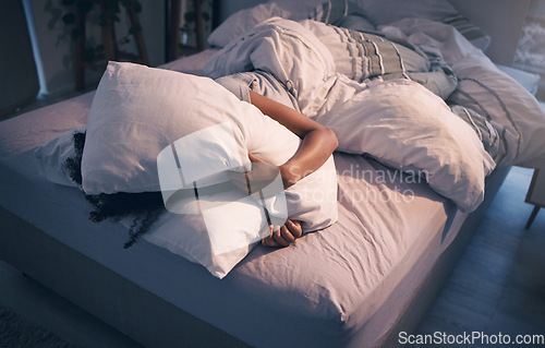 Image of Stress, insomnia and woman with pillow on face, tired and frustrated with sleep, nightmare or dream. Fatigue, sleeping problem and exhausted girl in bed with fear, scared at night and crisis in home.