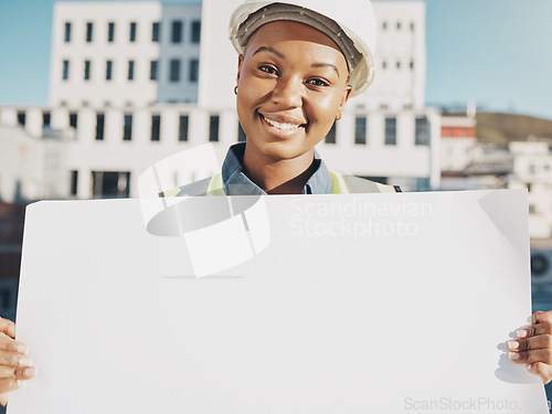 Image of Happy black woman, architect and billboard in city for construction plan, advertising or sale outdoors. Portrait of African female person, engineer or contractor holding sign, paper or board in town