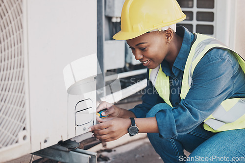 Image of Happy black woman, technician and building installation for air control, construction or vent on roof. African female person, contractor or engineer installing industrial equipment for architecture